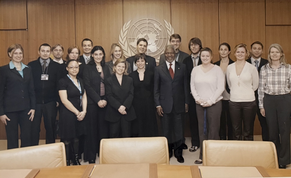 people standing behind the UN logo