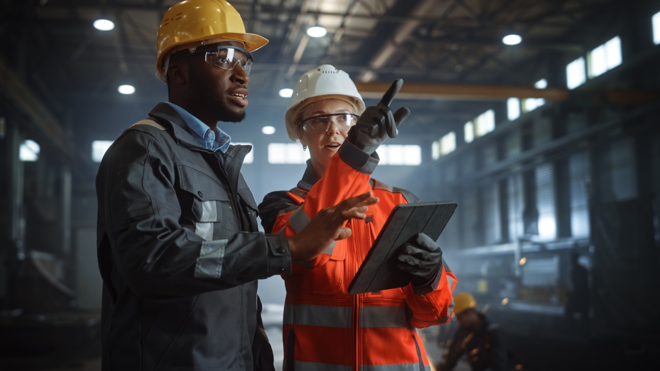 Two workers in conversation